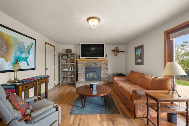 109 Cottonwood St, Manhattan, MT 59741 - living room featuring wood finished floors and a fireplace