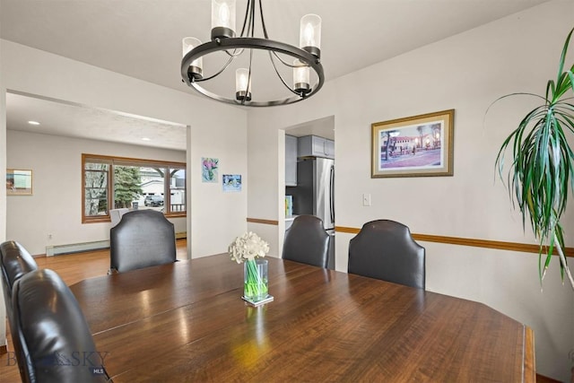109 Cottonwood St, Manhattan, MT 59741 - dining room with a chandelier, a baseboard radiator, and light wood-style floors