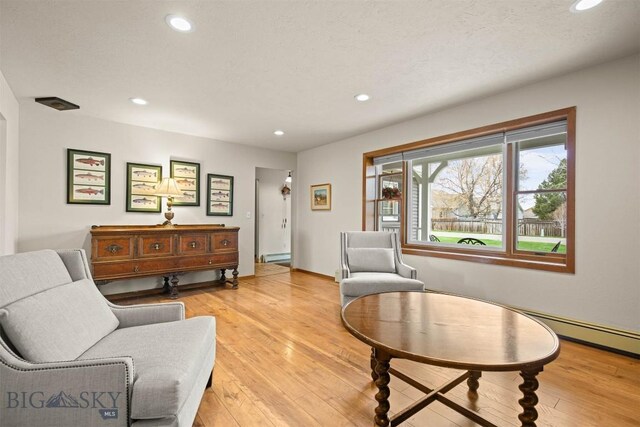 109 Cottonwood St, Manhattan, MT 59741 - living room with recessed lighting, light wood-style floors, and baseboard heating