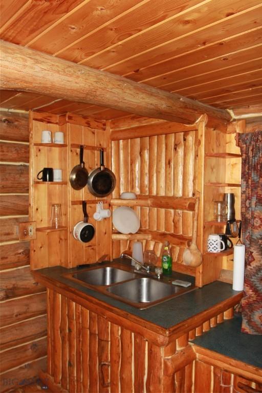 524 Grizzly Meadow Rd, Emigrant, MT 59027 - bar with a wood ceiling with exposed beams and rustic walls
