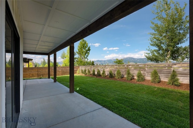 1440 Ryun Sun Way, Bozeman, MT 59718 - fenced backyard featuring a patio and a mountain view