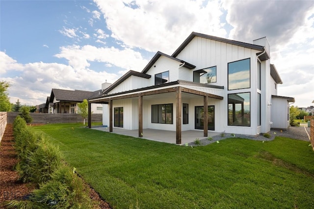 1440 Ryun Sun Way, Bozeman, MT 59718 - back of house featuring board and batten siding and a patio area