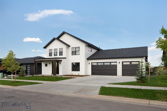 1440 Ryun Sun Way, Bozeman, MT 59718 - modern inspired farmhouse with board and batten siding, concrete driveway, a garage, and a front yard