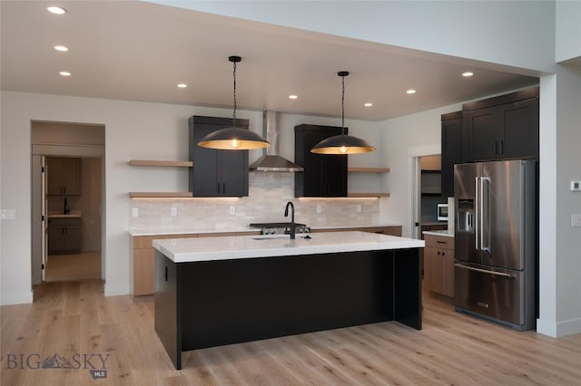 1440 Ryun Sun Way, Bozeman, MT 59718 - kitchen featuring high quality fridge, open shelves, wall chimney range hood, light countertops, and tasteful backsplash