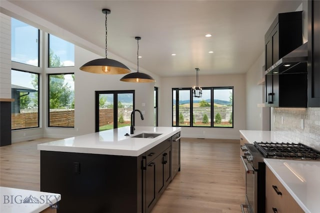 1440 Ryun Sun Way, Bozeman, MT 59718 - kitchen featuring stainless steel appliances, light wood-style flooring, light countertops, and recessed lighting