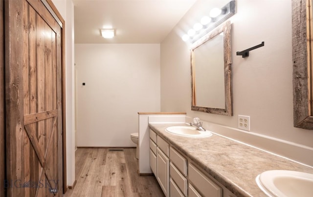 355 Buffalo Dr, Dillon, MT 59725 - bathroom with double vanity and wood finished floors