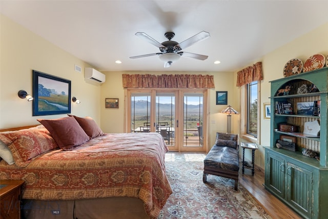 95 Foothill Trl, Ennis, MT 59729 - bedroom featuring access to outside, ceiling fan, light wood-style floors, recessed lighting, and a wall mounted air conditioner