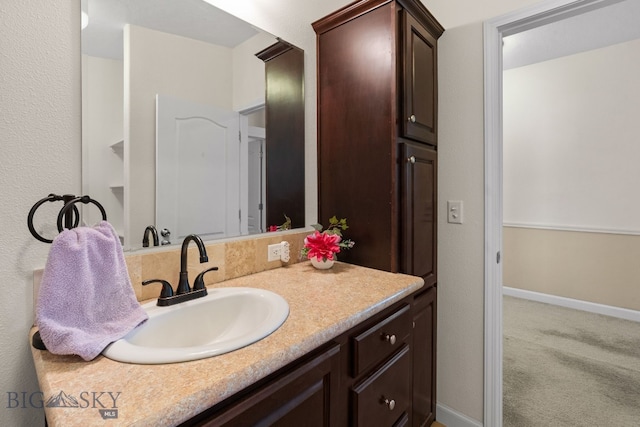 201 N Jackson St, Boulder, MT 59632 - bathroom with vanity and baseboards