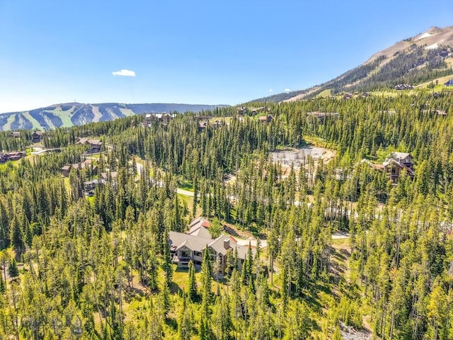 83 Peaks View Dr, Big Sky, MT 59718 - aerial view of a mountainous background and a heavily wooded area
