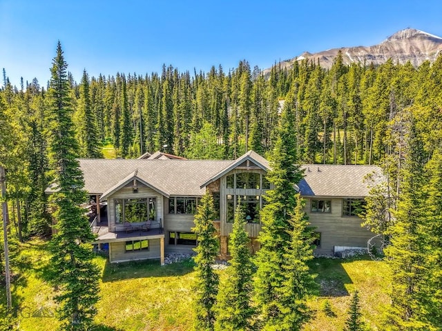 83 Peaks View Dr, Big Sky, MT 59718 - view from above of property with a mountain backdrop and a forest