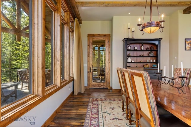 83 Peaks View Dr, Big Sky, MT 59718 - dining room featuring healthy amount of natural light, dark wood-style floors, and a chandelier