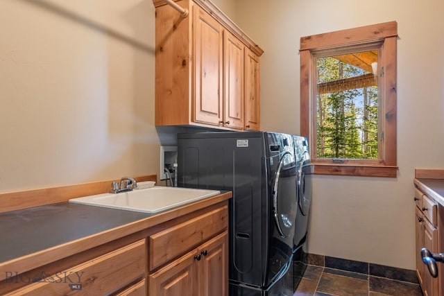 83 Peaks View Dr, Big Sky, MT 59718 - washroom with cabinet space, washer and clothes dryer, and dark stone finish flooring