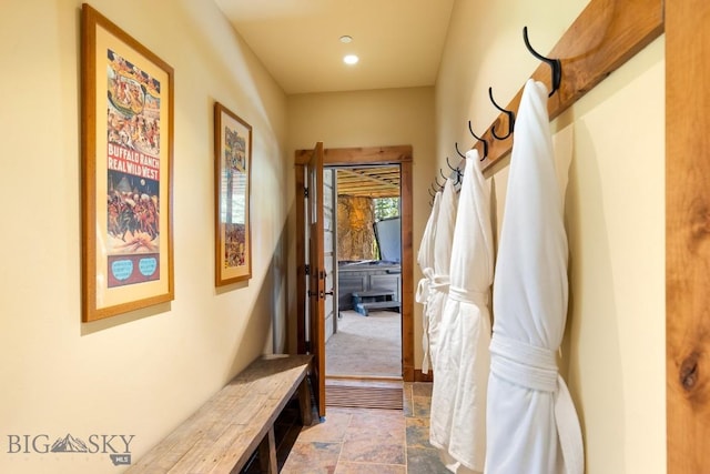 83 Peaks View Dr, Big Sky, MT 59718 - corridor featuring stone finish floors and recessed lighting