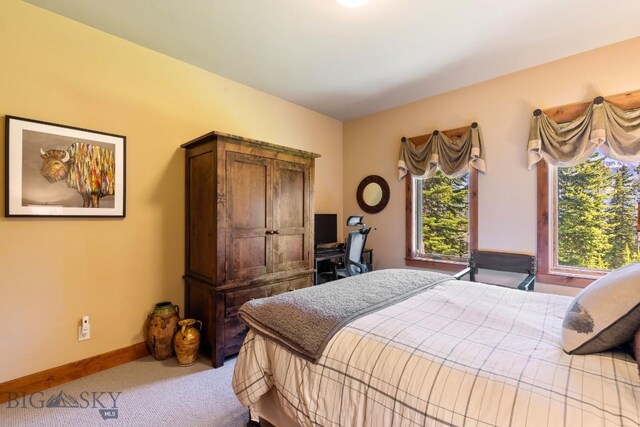 83 Peaks View Dr, Big Sky, MT 59718 - carpeted bedroom featuring baseboards