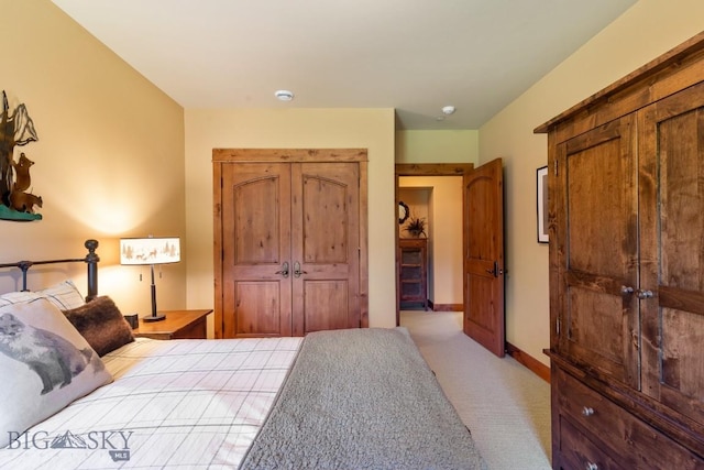 83 Peaks View Dr, Big Sky, MT 59718 - bedroom with light colored carpet and a closet