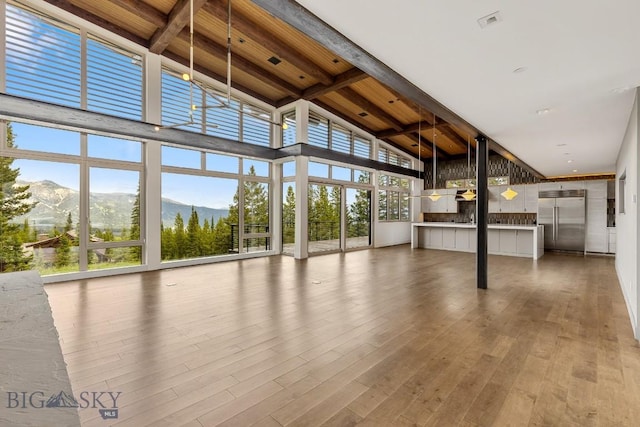 93 Goshawk Trl, Big Sky, MT 59716 - unfurnished sunroom with a mountain view