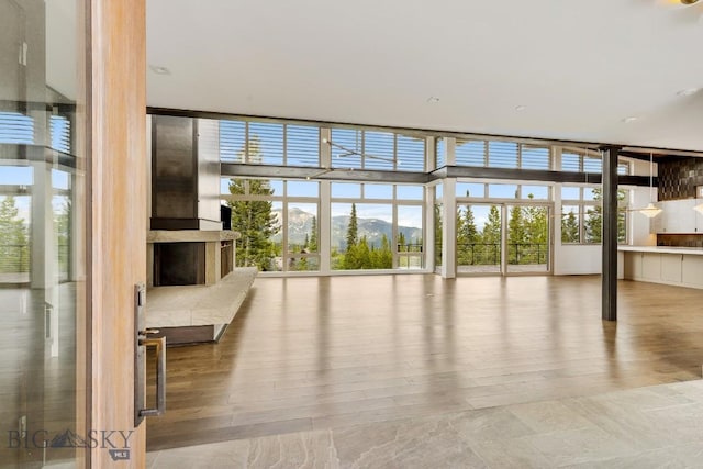 93 Goshawk Trl, Big Sky, MT 59716 - unfurnished sunroom with a mountain view
