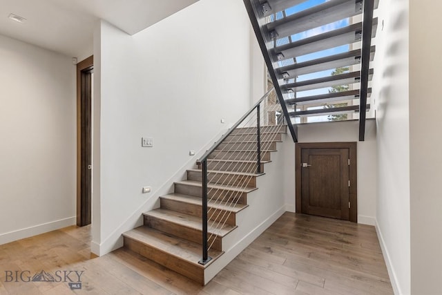 93 Goshawk Trl, Big Sky, MT 59716 - stairway featuring wood finished floors