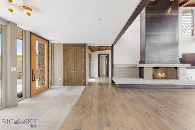 93 Goshawk Trl, Big Sky, MT 59716 - unfurnished living room featuring wood finished floors