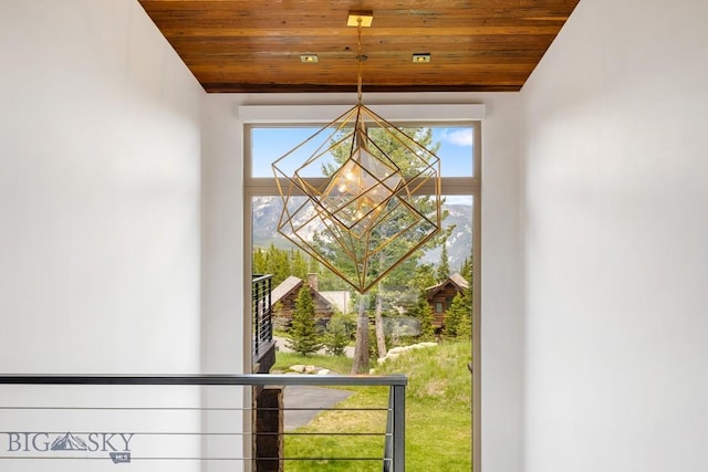 93 Goshawk Trl, Big Sky, MT 59716 - detailed view of a chandelier and stucco siding
