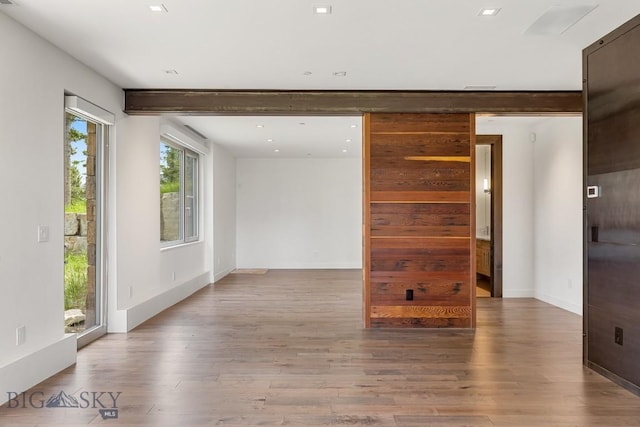 93 Goshawk Trl, Big Sky, MT 59716 - unfurnished room featuring wood finished floors and recessed lighting
