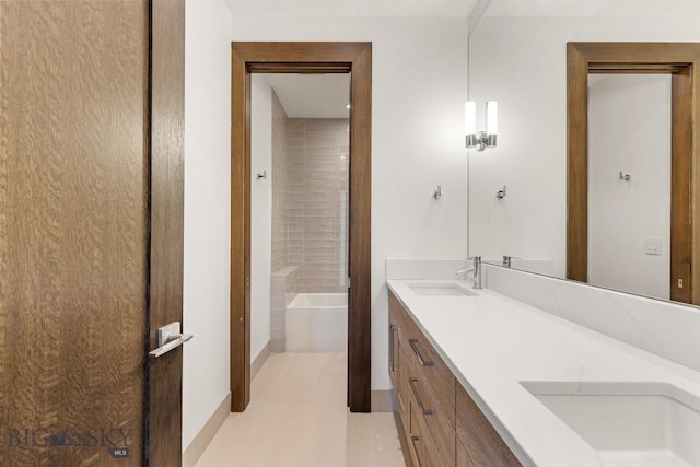 93 Goshawk Trl, Big Sky, MT 59716 - bathroom featuring double vanity and a tub to relax in