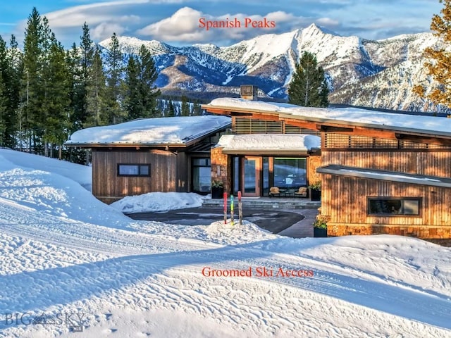 93 Goshawk Trl, Big Sky, MT 59716 - snow covered property featuring a mountain view