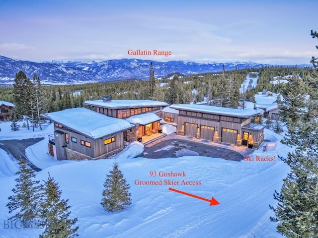 93 Goshawk Trl, Big Sky, MT 59716 - snowy aerial view featuring a mountain view