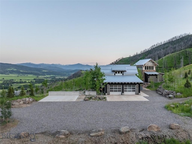 225 Alpen Strasse St, Bozeman, MT 59715 - exterior space with driveway, a mountain view, a garage, and a metal roof
