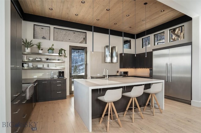 225 Alpen Strasse St, Bozeman, MT 59715 - kitchen with built in fridge, open shelves, modern cabinets, wooden ceiling, and light wood finished floors