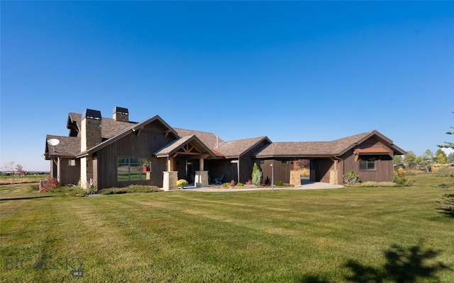 661 Doney Way, Bozeman, MT 59718 - rear view of house with a chimney and a yard