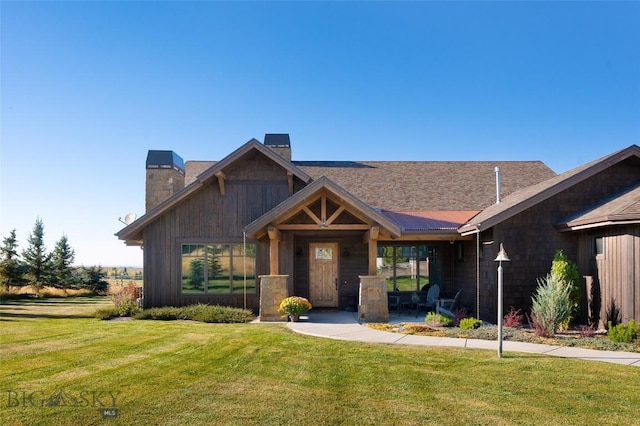 661 Doney Way, Bozeman, MT 59718 - view of front of home with a chimney and a front lawn