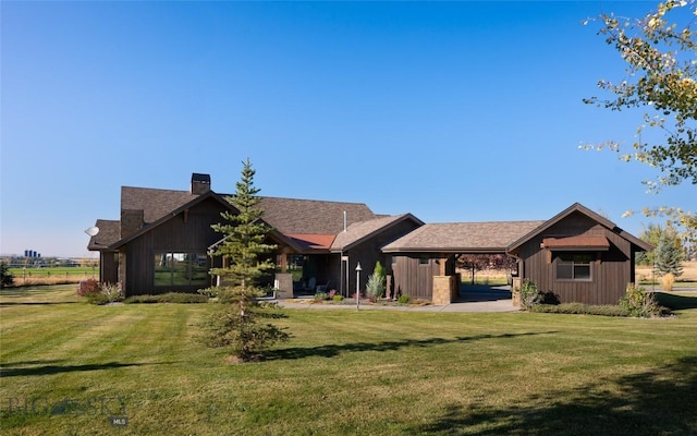 661 Doney Way, Bozeman, MT 59718 - view of front facade with a chimney and a front lawn