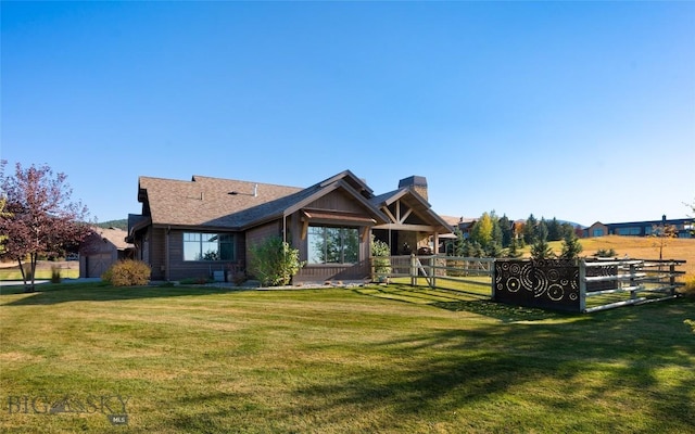 661 Doney Way, Bozeman, MT 59718 - rear view of house featuring a lawn and a chimney