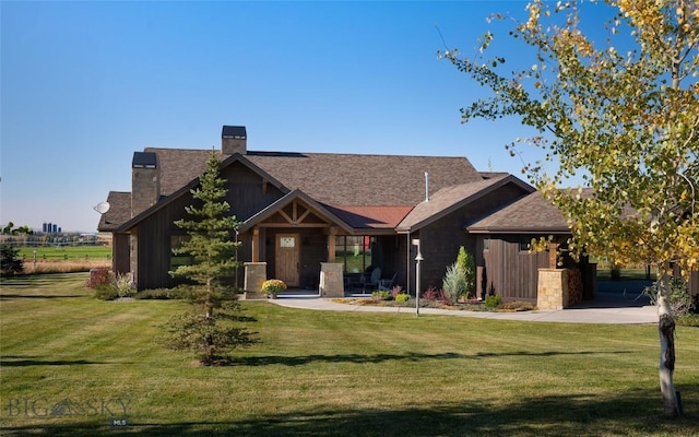 661 Doney Way, Bozeman, MT 59718 - craftsman inspired home with a chimney, a front lawn, board and batten siding, and roof with shingles
