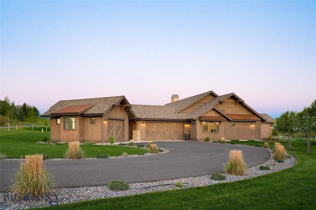 661 Doney Way, Bozeman, MT 59718 - view of front of home with an attached garage, a front yard, and asphalt driveway