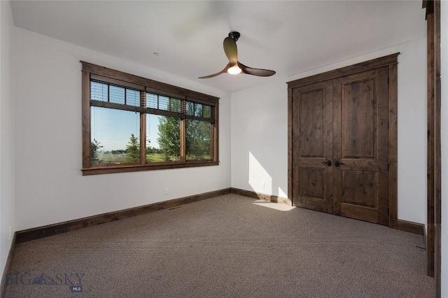 661 Doney Way, Bozeman, MT 59718 - unfurnished bedroom featuring carpet and a ceiling fan