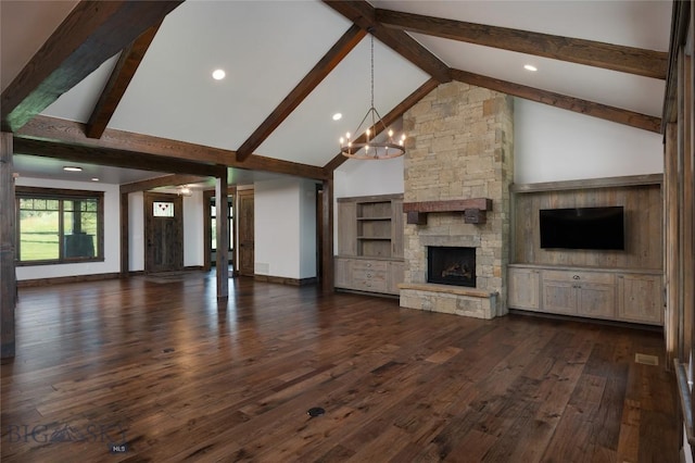 661 Doney Way, Bozeman, MT 59718 - unfurnished living room featuring a chandelier, a fireplace, beam ceiling, high vaulted ceiling, and dark wood-type flooring