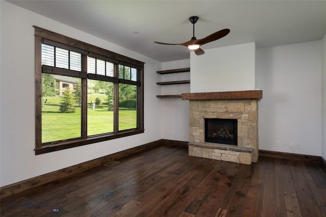 661 Doney Way, Bozeman, MT 59718 - unfurnished living room featuring dark wood finished floors, a stone fireplace, and a ceiling fan