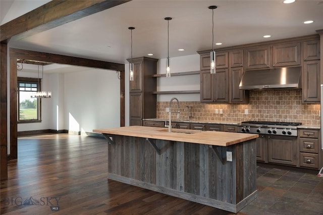 661 Doney Way, Bozeman, MT 59718 - kitchen featuring under cabinet range hood, stainless steel gas cooktop, open shelves, tasteful backsplash, and recessed lighting