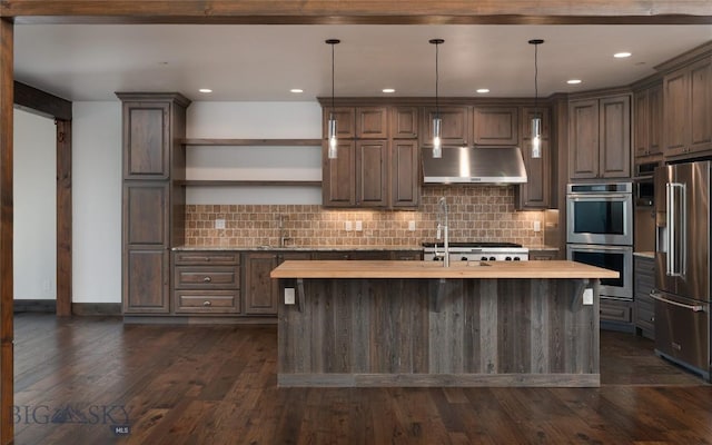 661 Doney Way, Bozeman, MT 59718 - kitchen featuring stainless steel appliances, exhaust hood, open shelves, tasteful backsplash, and an island with sink