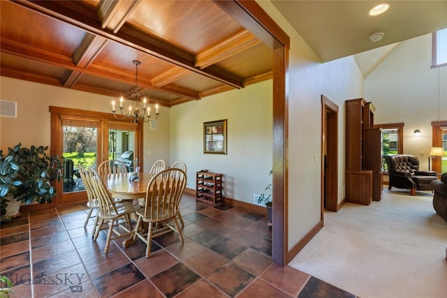 619 Terrance Loop, Bozeman, MT 59718 - dining space with a chandelier, beam ceiling, and coffered ceiling