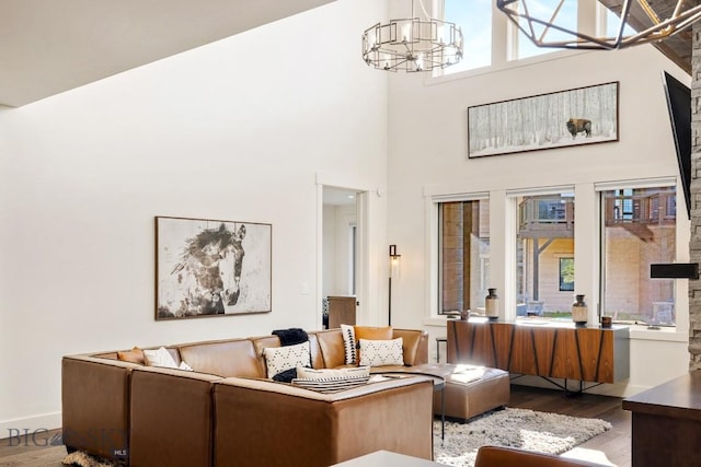 425 Outlook Trl, Big Sky, MT 59716 - living area featuring wood finished floors, a chandelier, and a towering ceiling