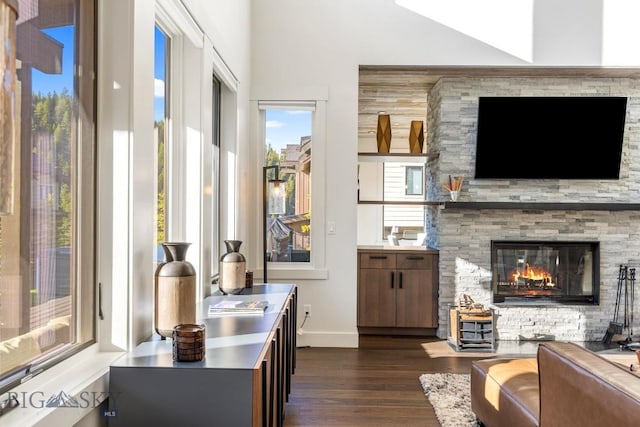 425 Outlook Trl, Big Sky, MT 59716 - living room with dark wood finished floors and a stone fireplace