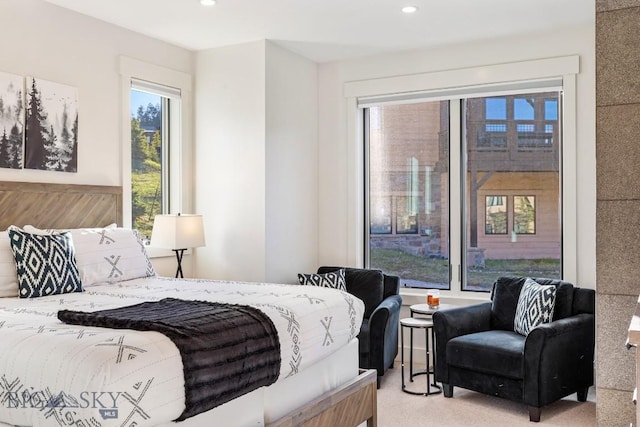 425 Outlook Trl, Big Sky, MT 59716 - bedroom featuring multiple windows, recessed lighting, and light carpet