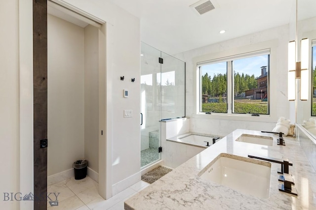 425 Outlook Trl, Big Sky, MT 59716 - full bathroom featuring a stall shower, double vanity, a bath, and recessed lighting