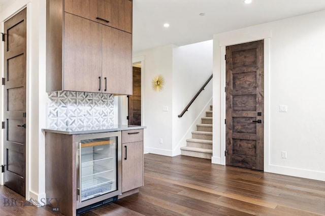 425 Outlook Trl, Big Sky, MT 59716 - bar with beverage cooler, stairs, dark wood-style flooring, recessed lighting, and tasteful backsplash