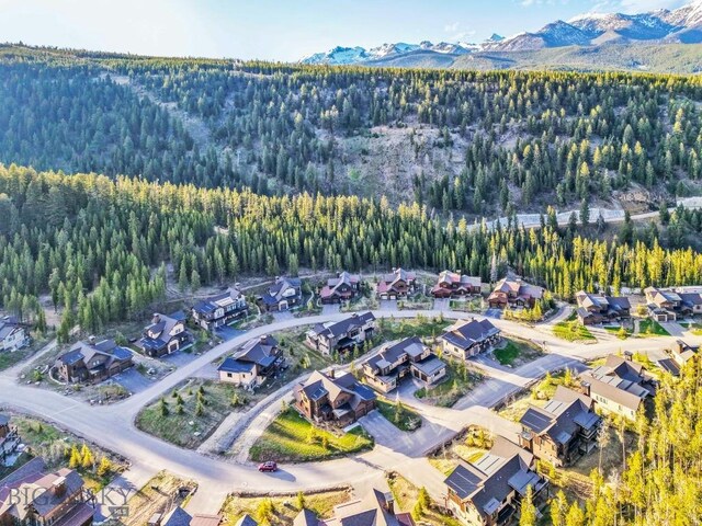 425 Outlook Trl, Big Sky, MT 59716 - view of property location featuring a mountainous background and nearby suburban area