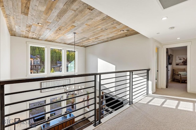 425 Outlook Trl, Big Sky, MT 59716 - hall featuring carpet flooring, recessed lighting, wood ceiling, an upstairs landing, and a chandelier