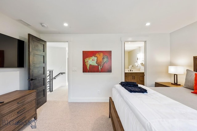 425 Outlook Trl, Big Sky, MT 59716 - bedroom with light colored carpet, recessed lighting, and ensuite bath